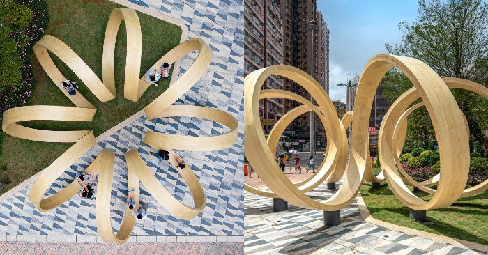  The public is invited to lounge and play at the same time in a wooden infinite loop installation.