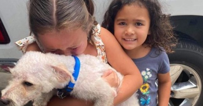  Finally again together: cute girls cried after a policeman reunited them with their missing dog